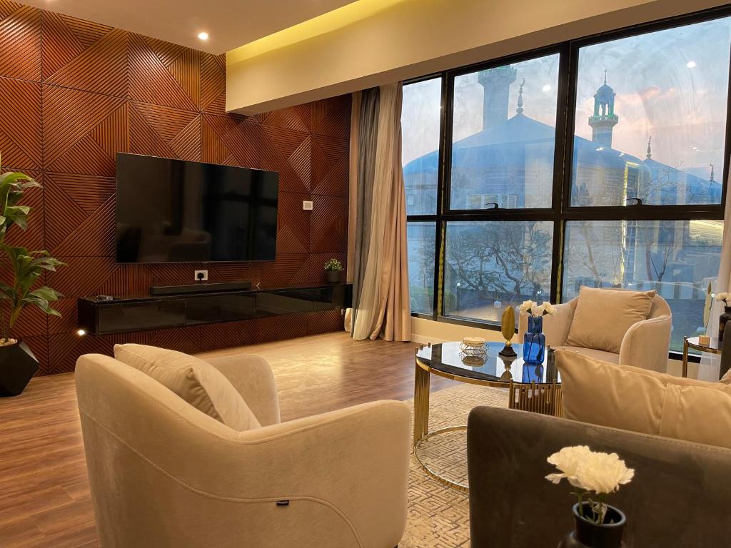 TV a/nebo společenská místnost v ubytování Family Luxury apartment at Milsa Nasr City , Building 27