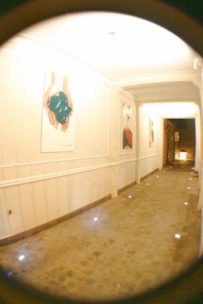 a view of a hallway in a building with a mirror at B&B Wellness Yoake in Ypres