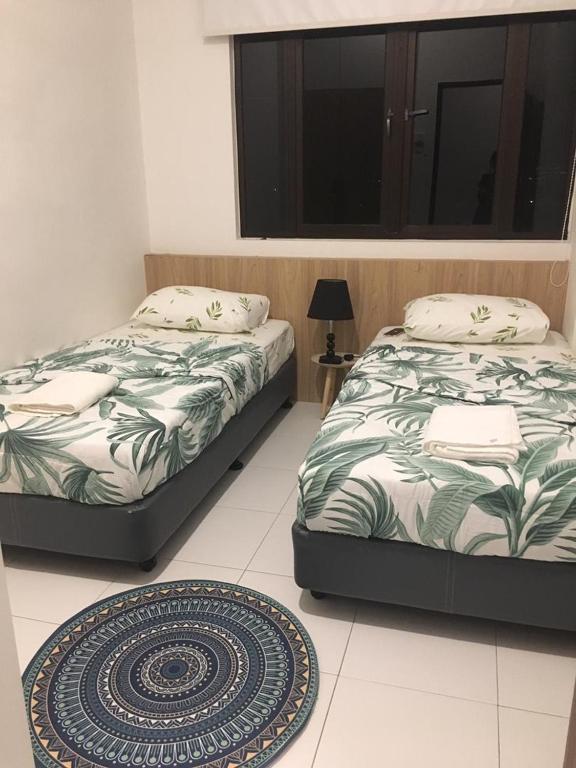 Postel nebo postele na pokoji v ubytování Imperio Homestay Alor Star