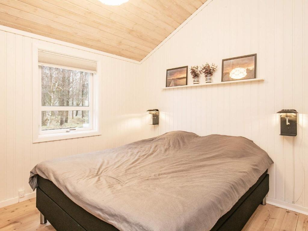 Postel nebo postele na pokoji v ubytování Holiday home Jerup XLVIII