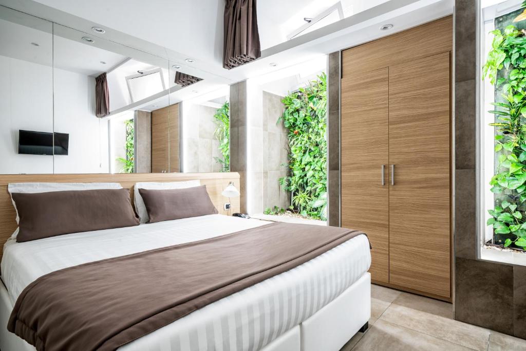 Una cama o camas en una habitación de Hotel Paolo II