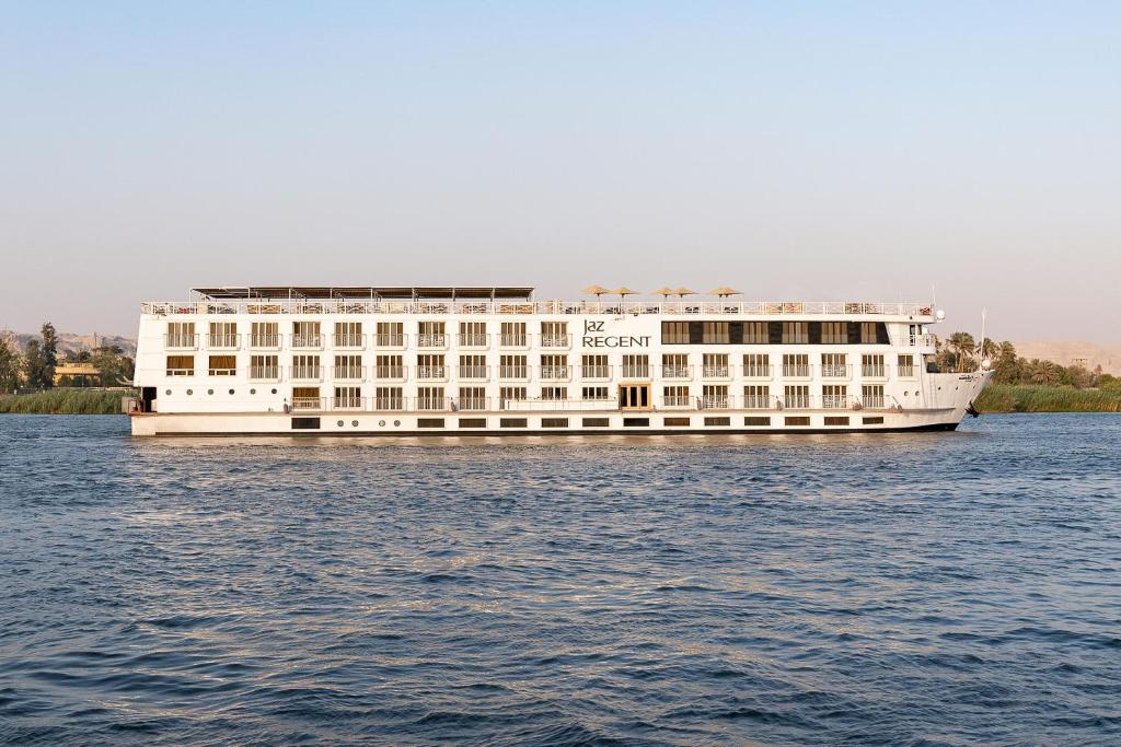 a large white building in the middle of the water at Jaz Regent Nile Cruise - Every Monday from Luxor for 07 & 04 Nights - Every Friday From Aswan for 03 Nights in Luxor