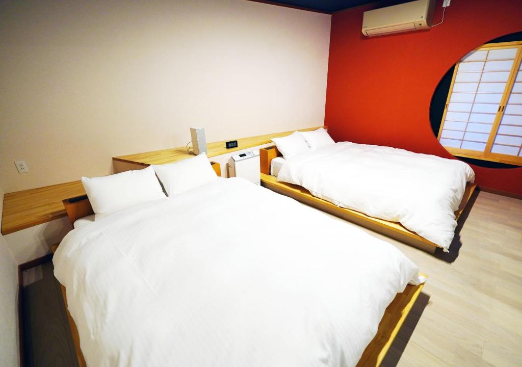 Postel nebo postele na pokoji v ubytování ATAMI SPRING TERRACE HOTEL