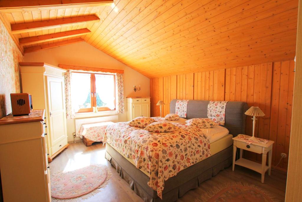 a bedroom with a bed and a window in it at Landhaus Hotel Romantik in Gotha