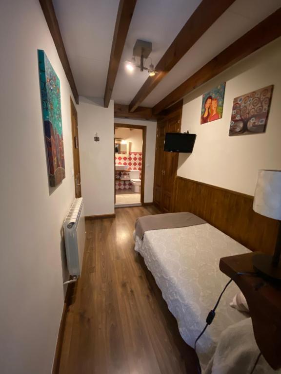 Postel nebo postele na pokoji v ubytování Pensión Arbidel