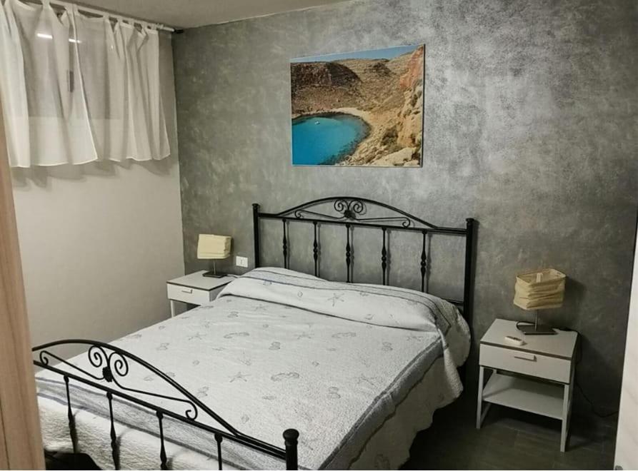 Llit o llits en una habitació de Appartamento a 200m dal mare