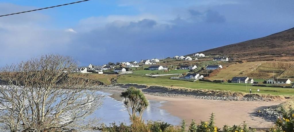 a village on a hill with a river and houses at Creevagh (Room Only) in Keel