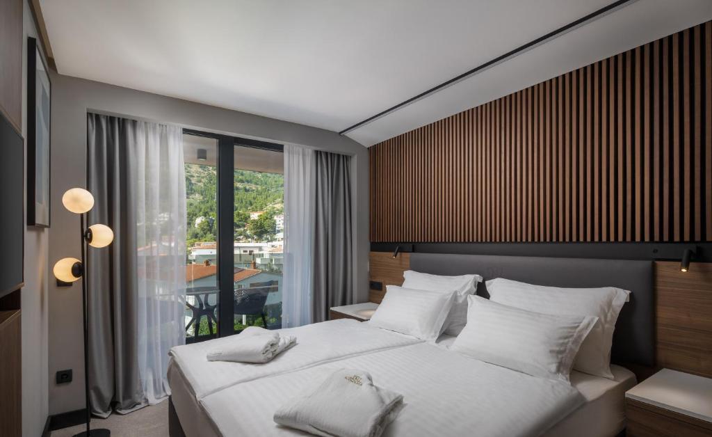 Postel nebo postele na pokoji v ubytování Boutique Hotel Noemia