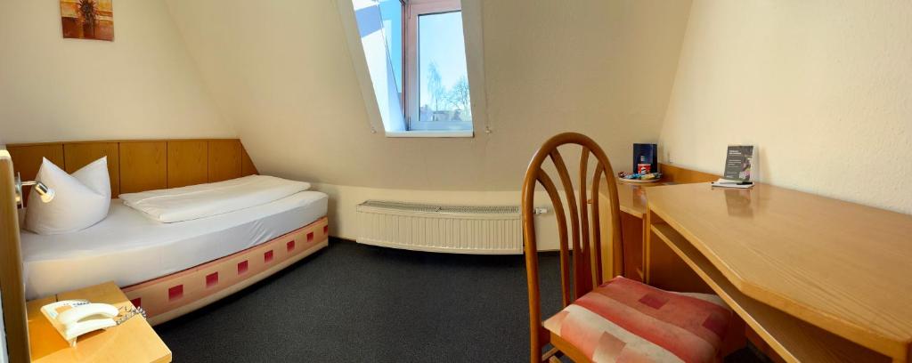 Postel nebo postele na pokoji v ubytování Hotel Maucksches Gut