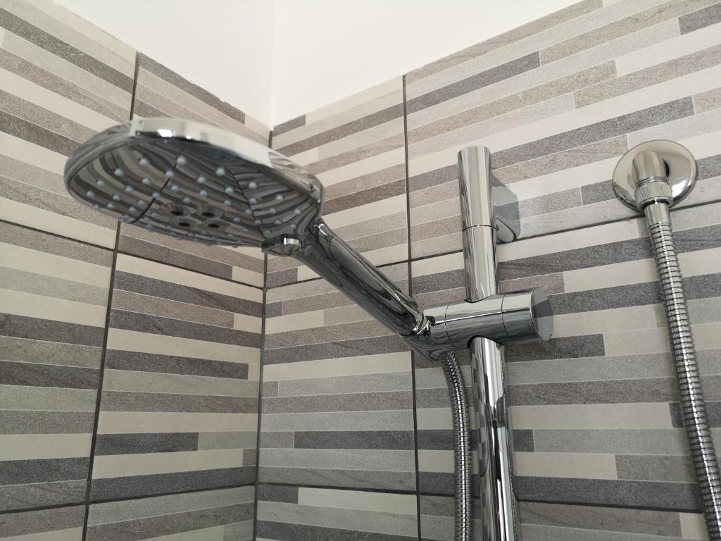 a shower head on the side of a building at Villa Caravaggio Comfort e Relax in Rocca San Giovanni