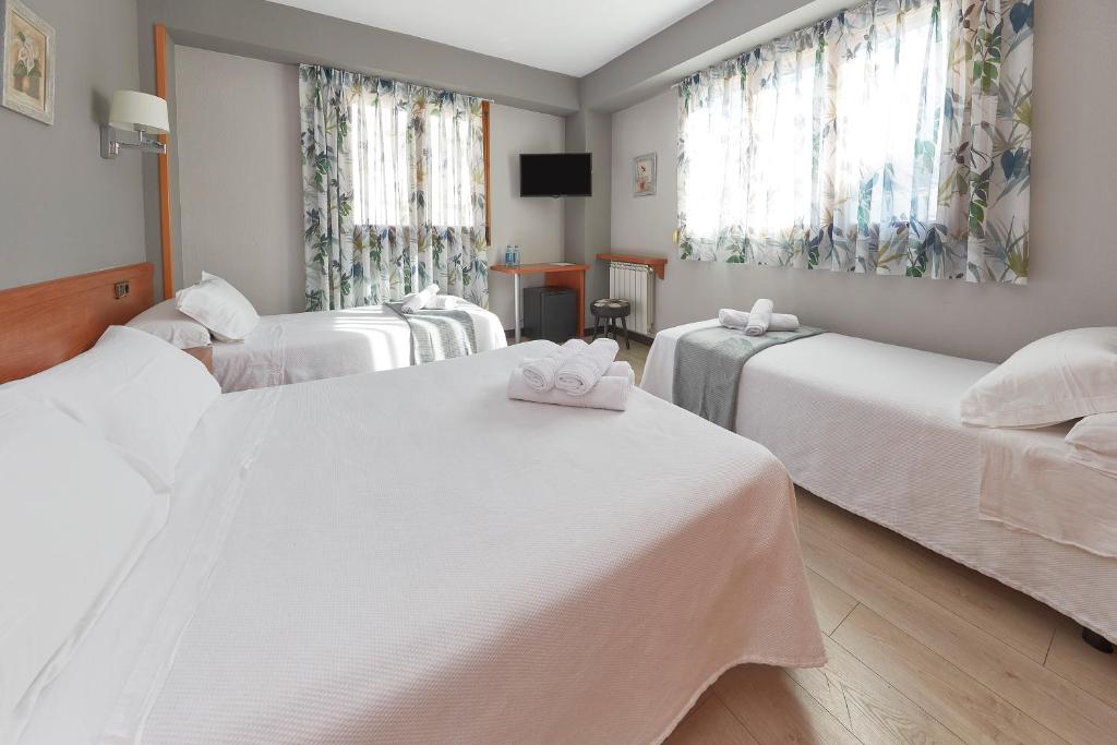 Cama o camas de una habitación en Hotel Sanchez