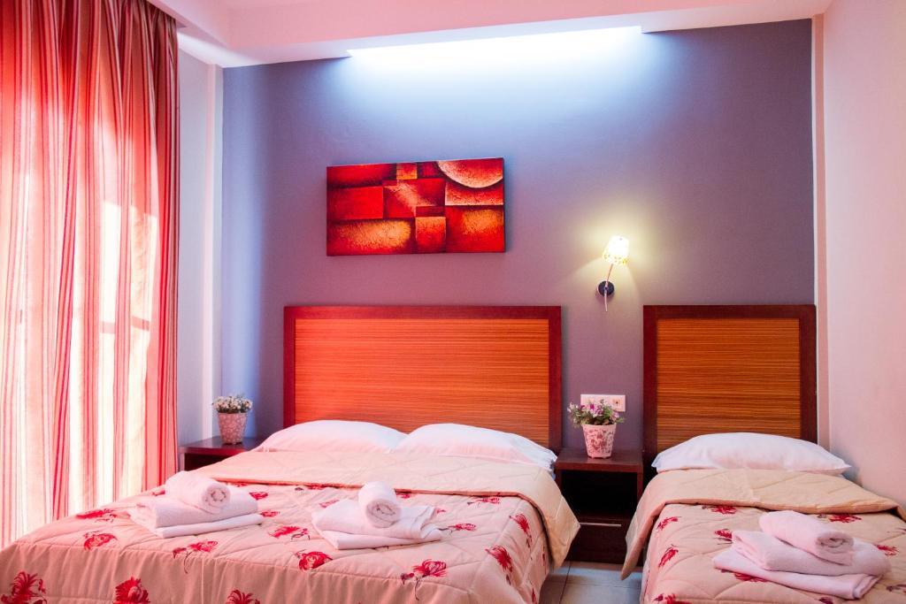 Postel nebo postele na pokoji v ubytování Hotel Rodon