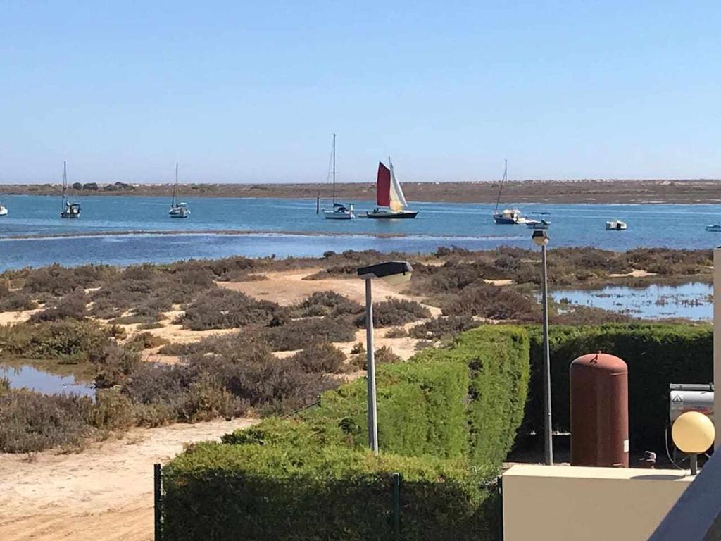 a view of a body of water with boats in it at River House, T2 Tavira – Santa Luzia in Tavira