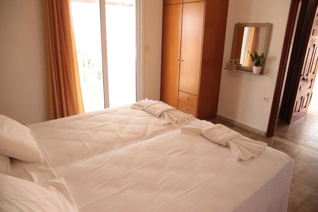 Postel nebo postele na pokoji v ubytování Villa Argiris