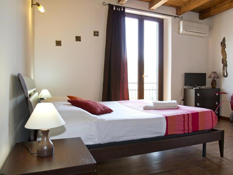 Postel nebo postele na pokoji v ubytování Cuscino e Cappuccino B&B