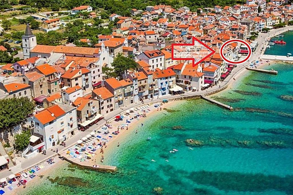 an aerial view of a beach with a clock on it at Apartment Sara in Baška