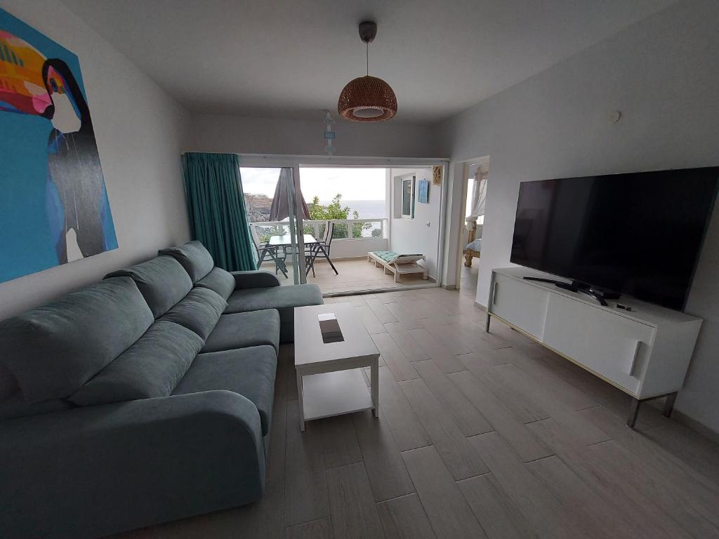 Televízia a/alebo spoločenská miestnosť v ubytovaní Beachview oriental design experience