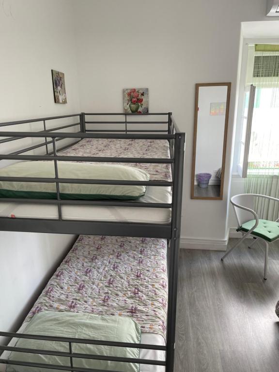 Postel nebo postele na pokoji v ubytování Aloha Hostel
