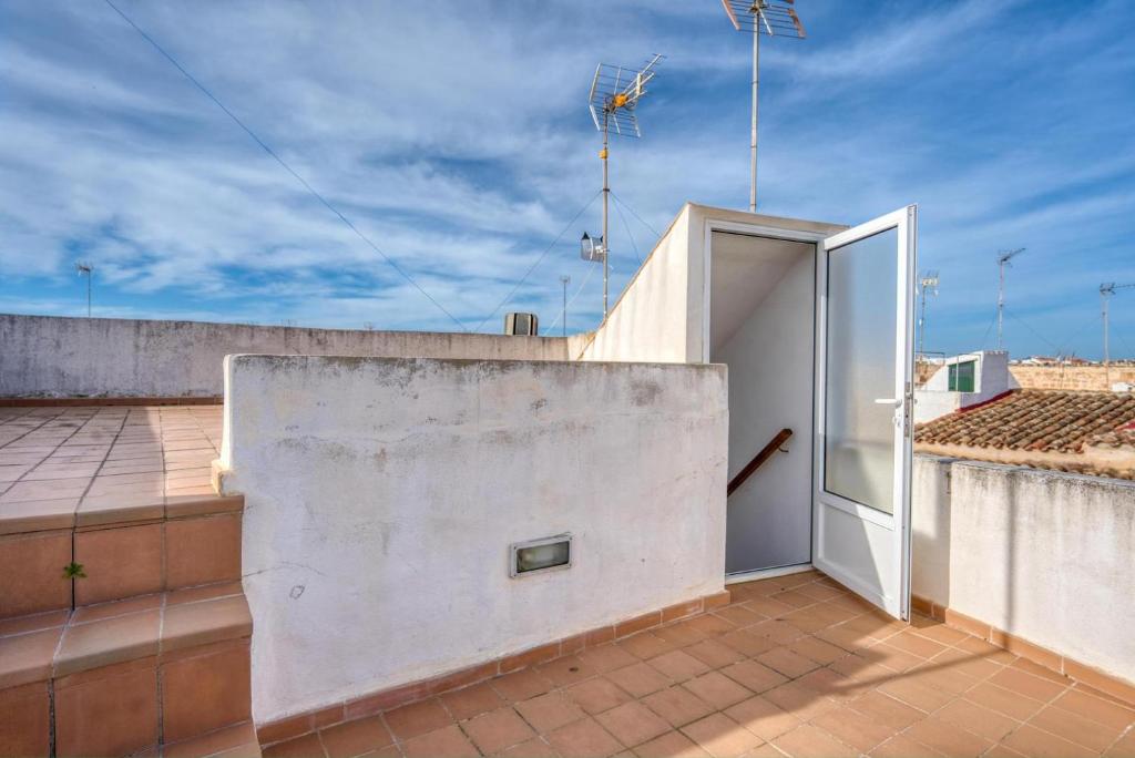 an open door on the roof of a building at Casa Ses Roques in Ciutadella