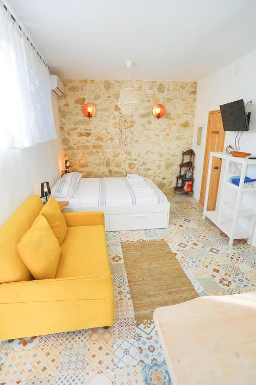A bed or beds in a room at Ravi Boutique Home - 1 minute walk from beach