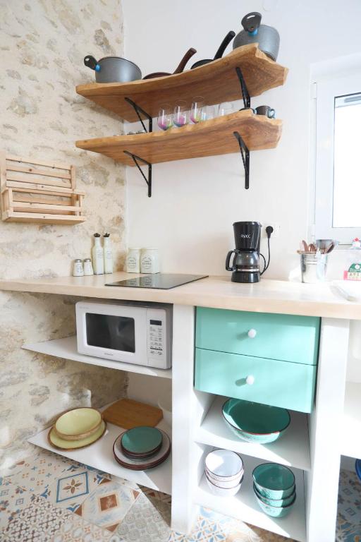 A kitchen or kitchenette at Ravi Boutique Home - 1 minute walk from beach