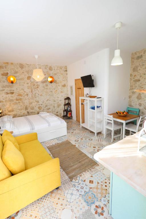 A bed or beds in a room at Ravi Boutique Home - 1 minute walk from beach