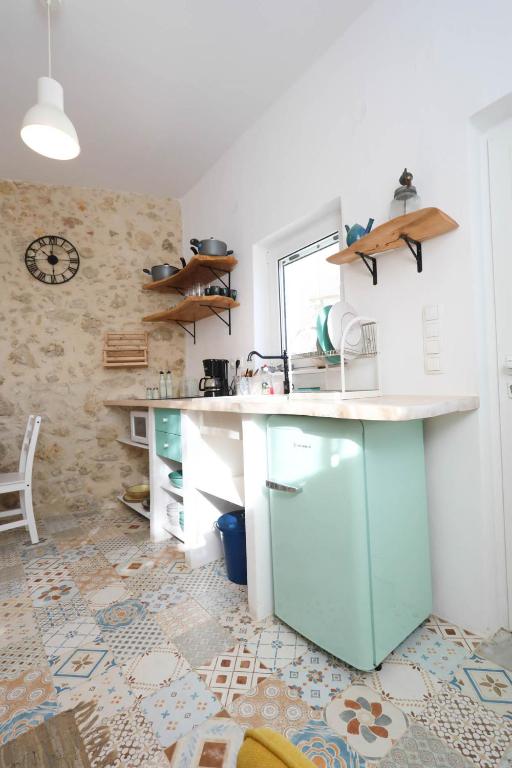 A kitchen or kitchenette at Ravi Boutique Home - 1 minute walk from beach
