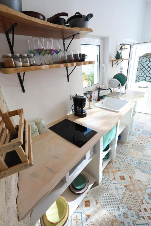 A kitchen or kitchenette at Ravi Boutique Home - 1 minute walk from beach