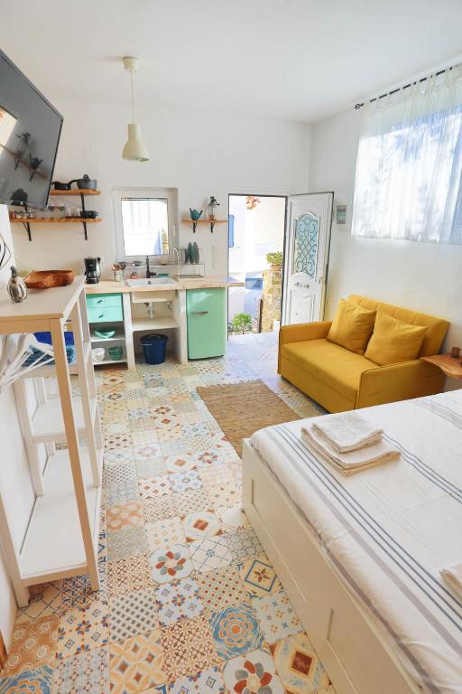 A television and/or entertainment centre at Ravi Boutique Home - 1 minute walk from beach