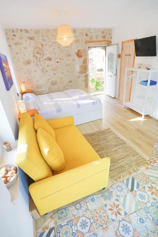 A bed or beds in a room at Ravi Boutique Home - 1 minute walk from beach