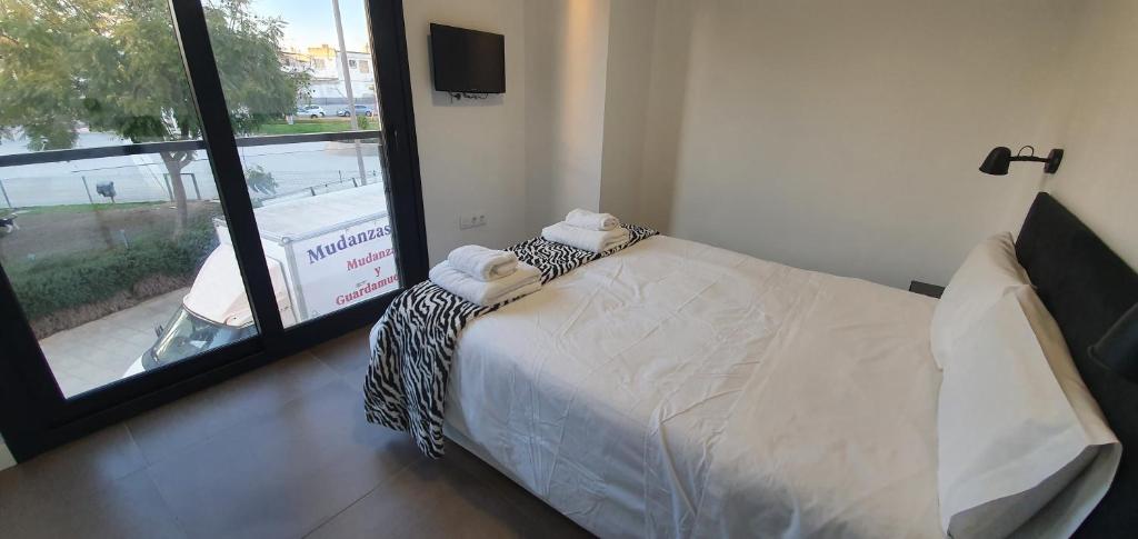A bed or beds in a room at CARLOS APARTAMENTo