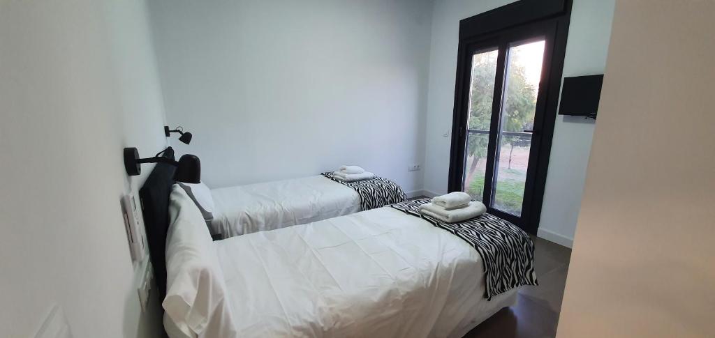 A bed or beds in a room at CARLOS APARTAMENTo