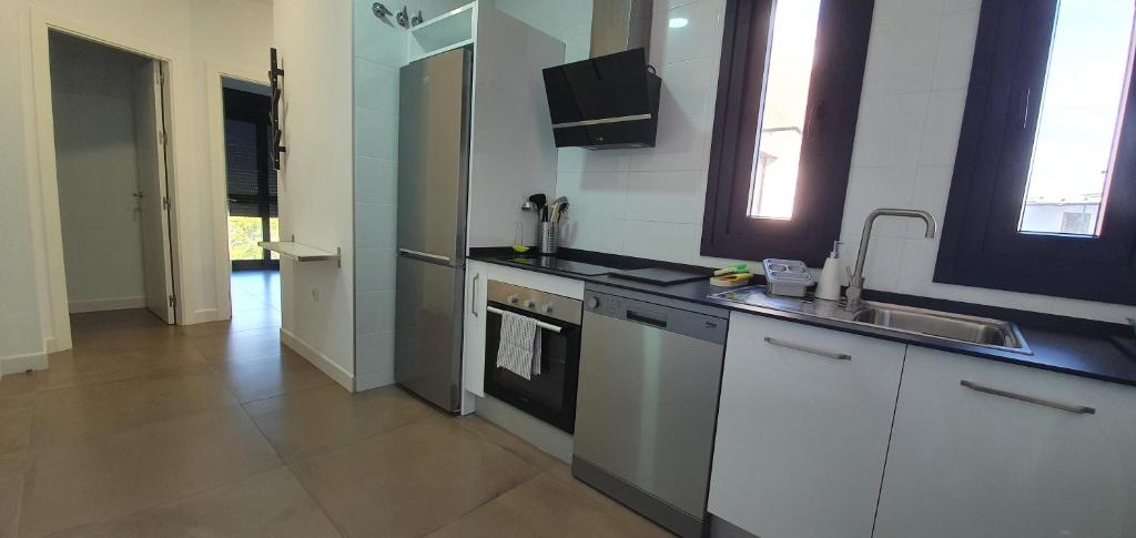 A kitchen or kitchenette at CARLOS APARTAMENTo