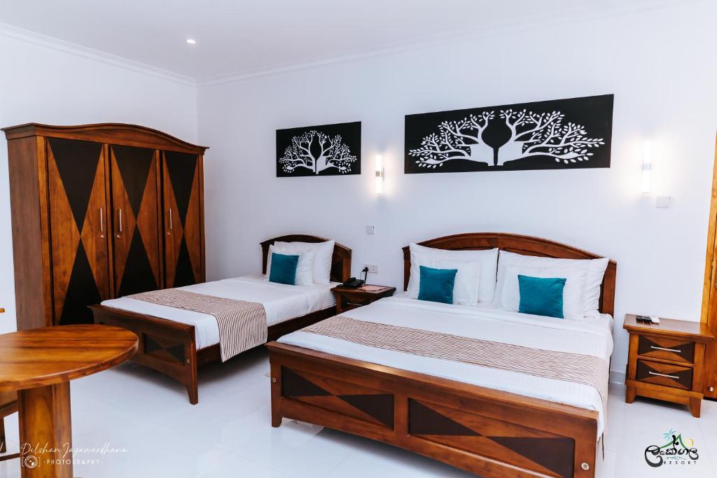 Postel nebo postele na pokoji v ubytování Lakegala Resort