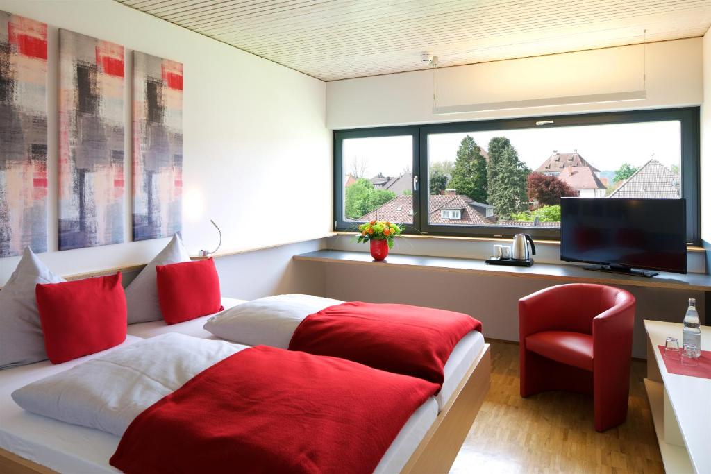 Postel nebo postele na pokoji v ubytování Bed & Breakfast Rotes Haus