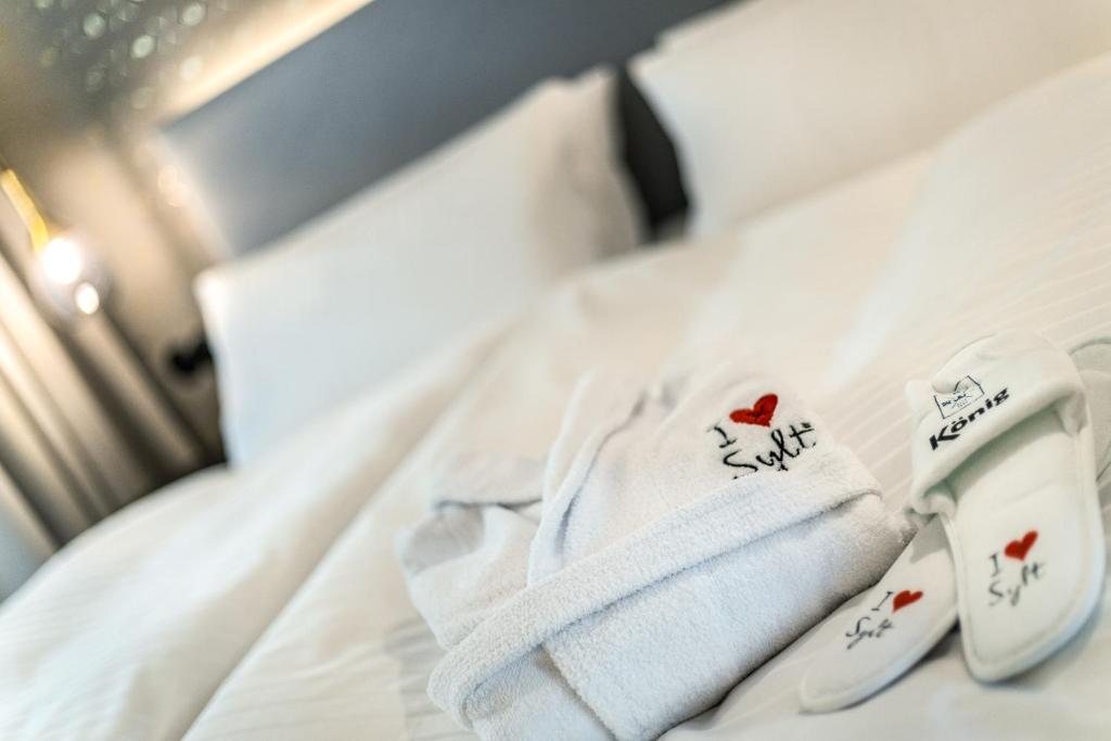Voodi või voodid majutusasutuse I LOVE SYLT Hotel Terminus ADULTS ONLY toas
