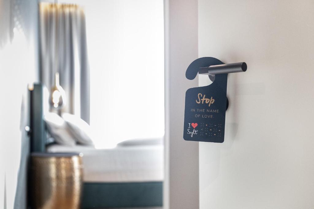 Voodi või voodid majutusasutuse I LOVE SYLT Hotel Terminus ADULTS ONLY toas