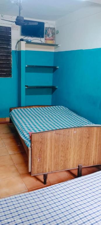 A bed or beds in a room at Xavier Guest House