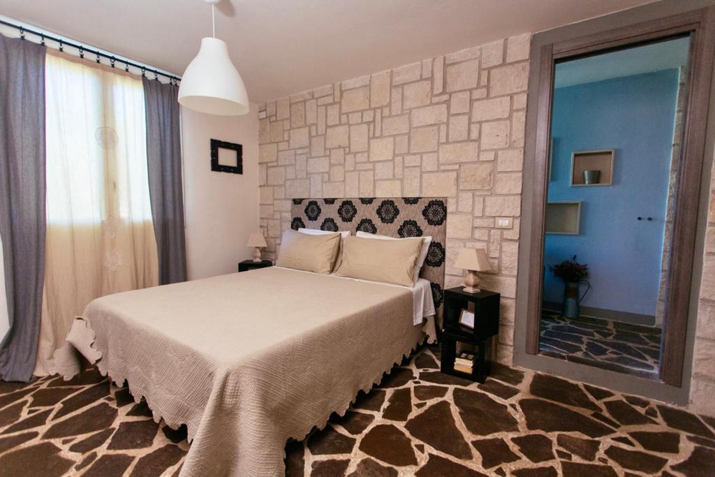 Posteľ alebo postele v izbe v ubytovaní Stone House Modica