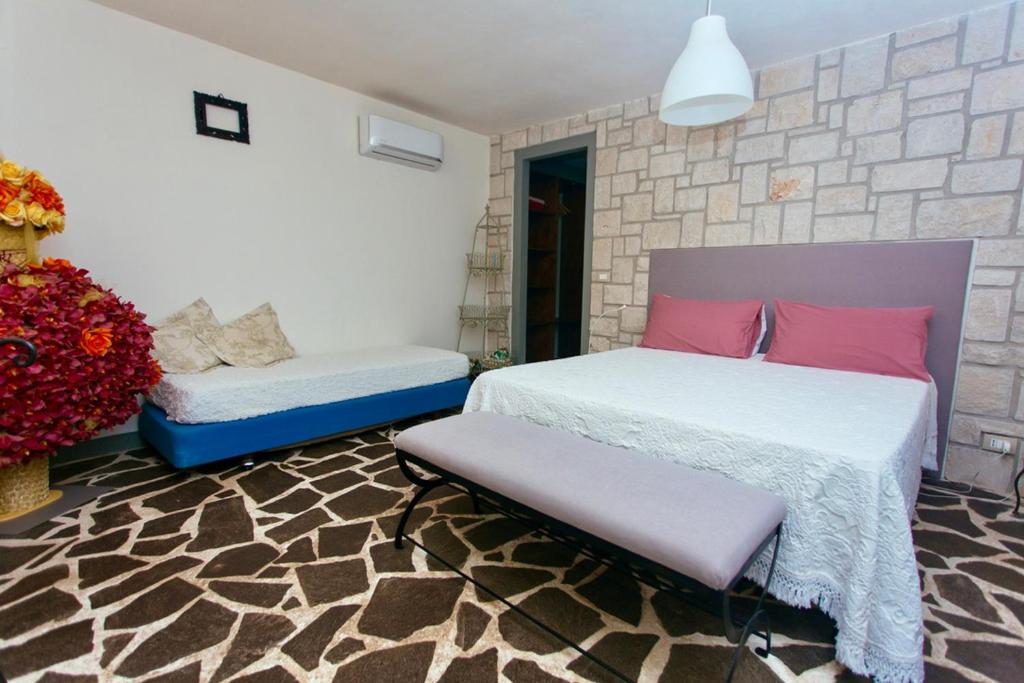 Posteľ alebo postele v izbe v ubytovaní Stone House Modica