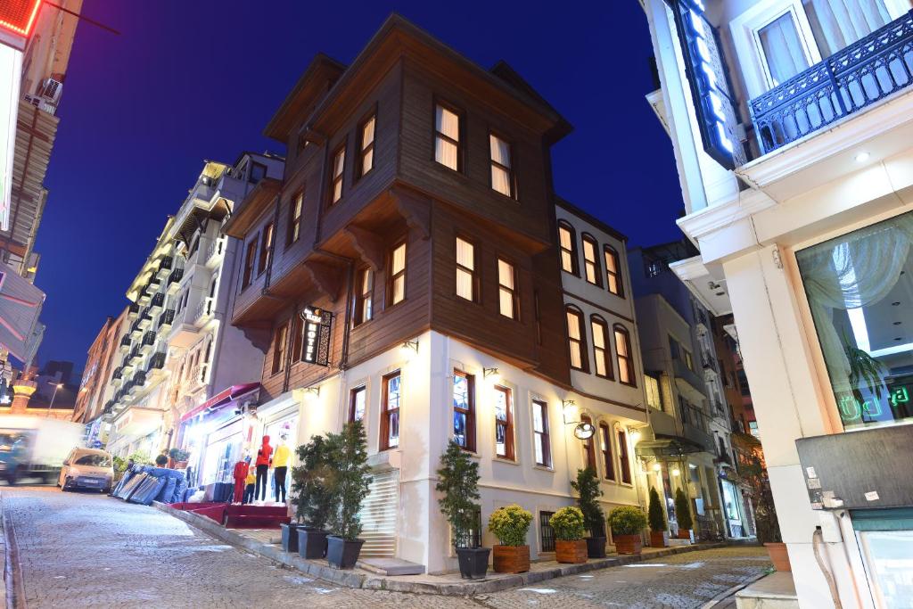 a building on a city street at night at Elyka Hotel in Istanbul