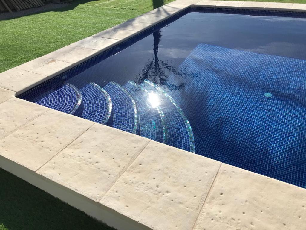 a swimming pool with a water hose in it at Villa Casa Segunda in Lliria