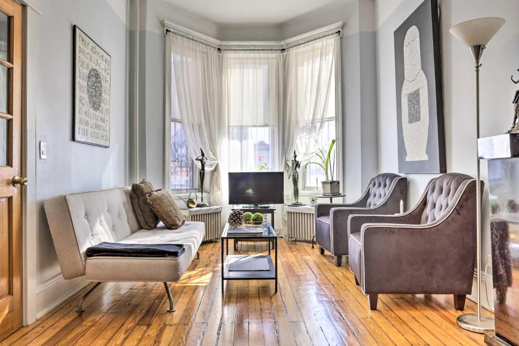 a living room with two chairs and a couch at Contemporary Jersey City Abode about 5 Mi to NYC! in Jersey City