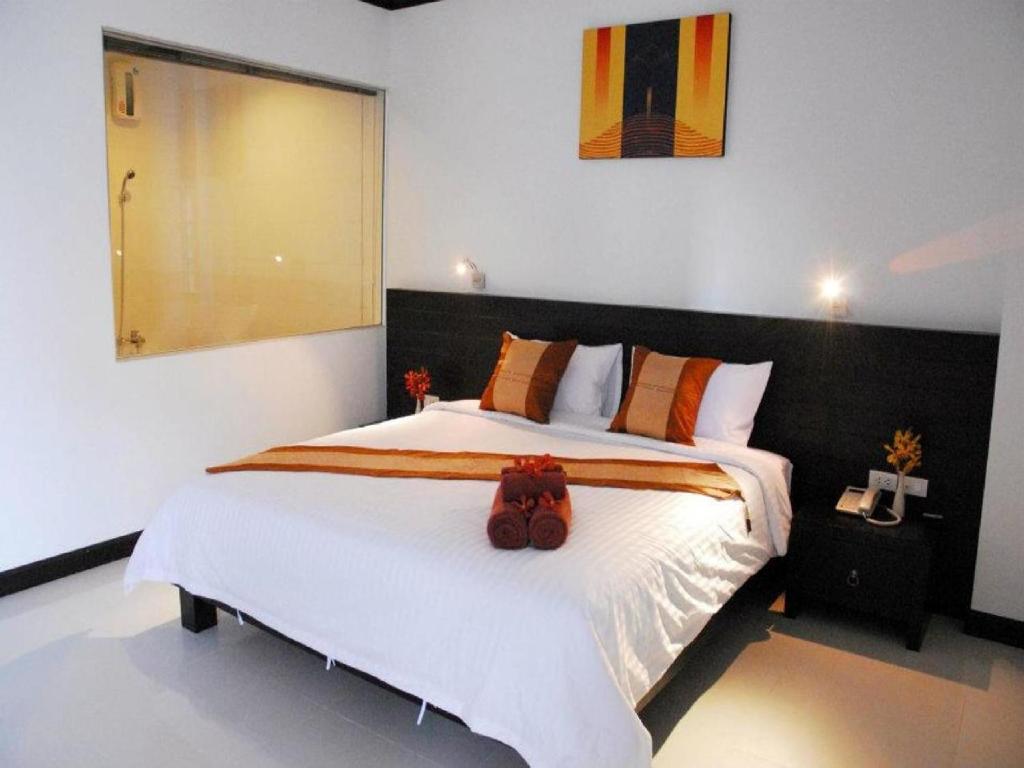 Postel nebo postele na pokoji v ubytování Tanawit Hotel & Spa