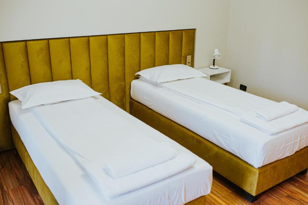 Postel nebo postele na pokoji v ubytování HOTEL VITAL