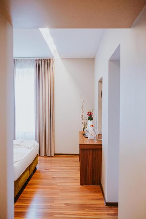 Postel nebo postele na pokoji v ubytování HOTEL VITAL