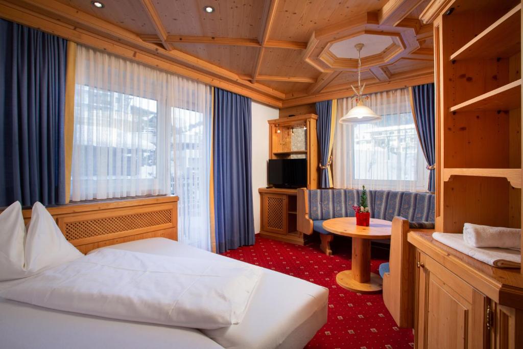 Postel nebo postele na pokoji v ubytování Hotel Tannenberg