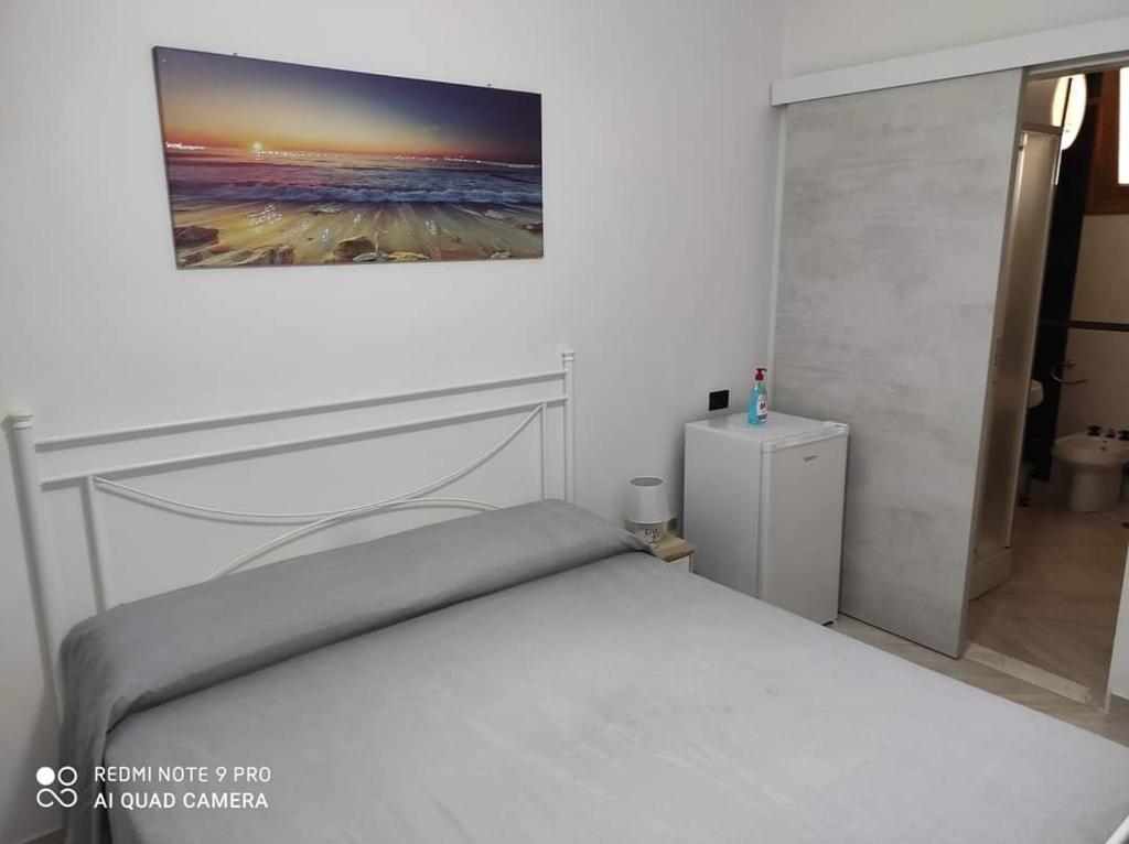 Posteľ alebo postele v izbe v ubytovaní B&B Annunziata