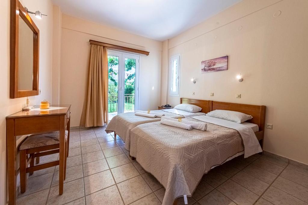 Postel nebo postele na pokoji v ubytování Anesis Residence