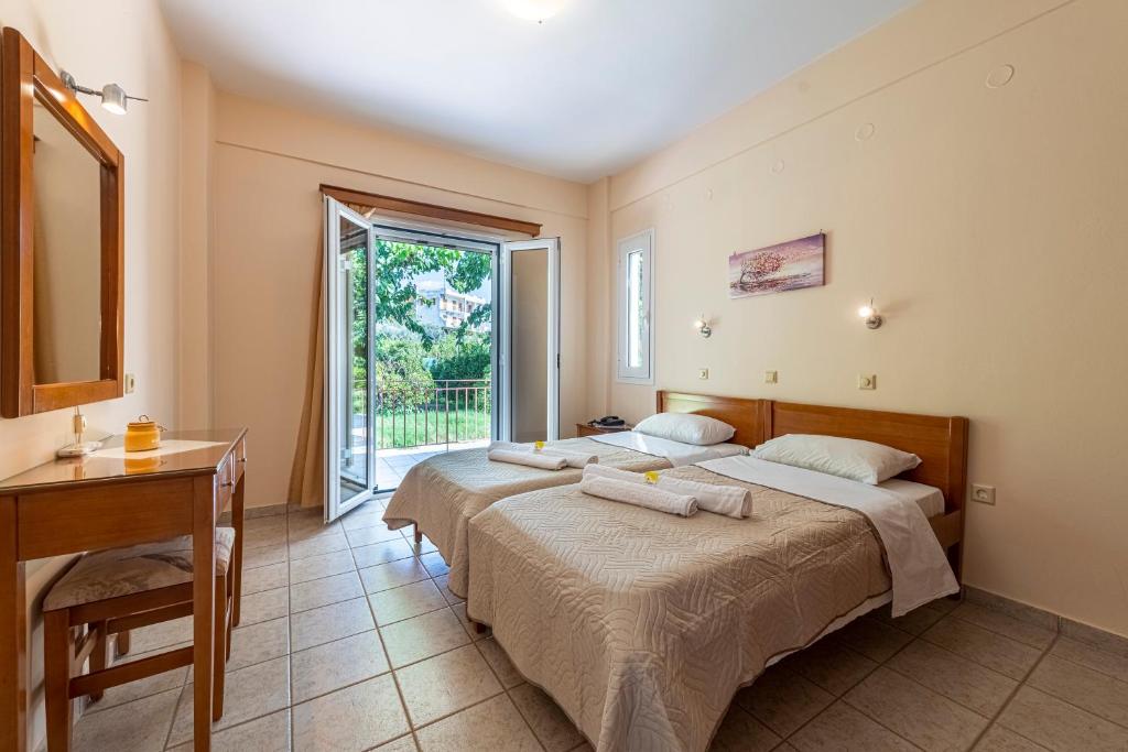 Postel nebo postele na pokoji v ubytování Anesis Residence